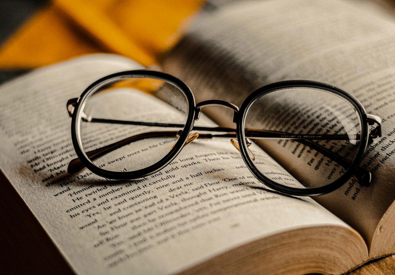 An eyeglasses on an open book