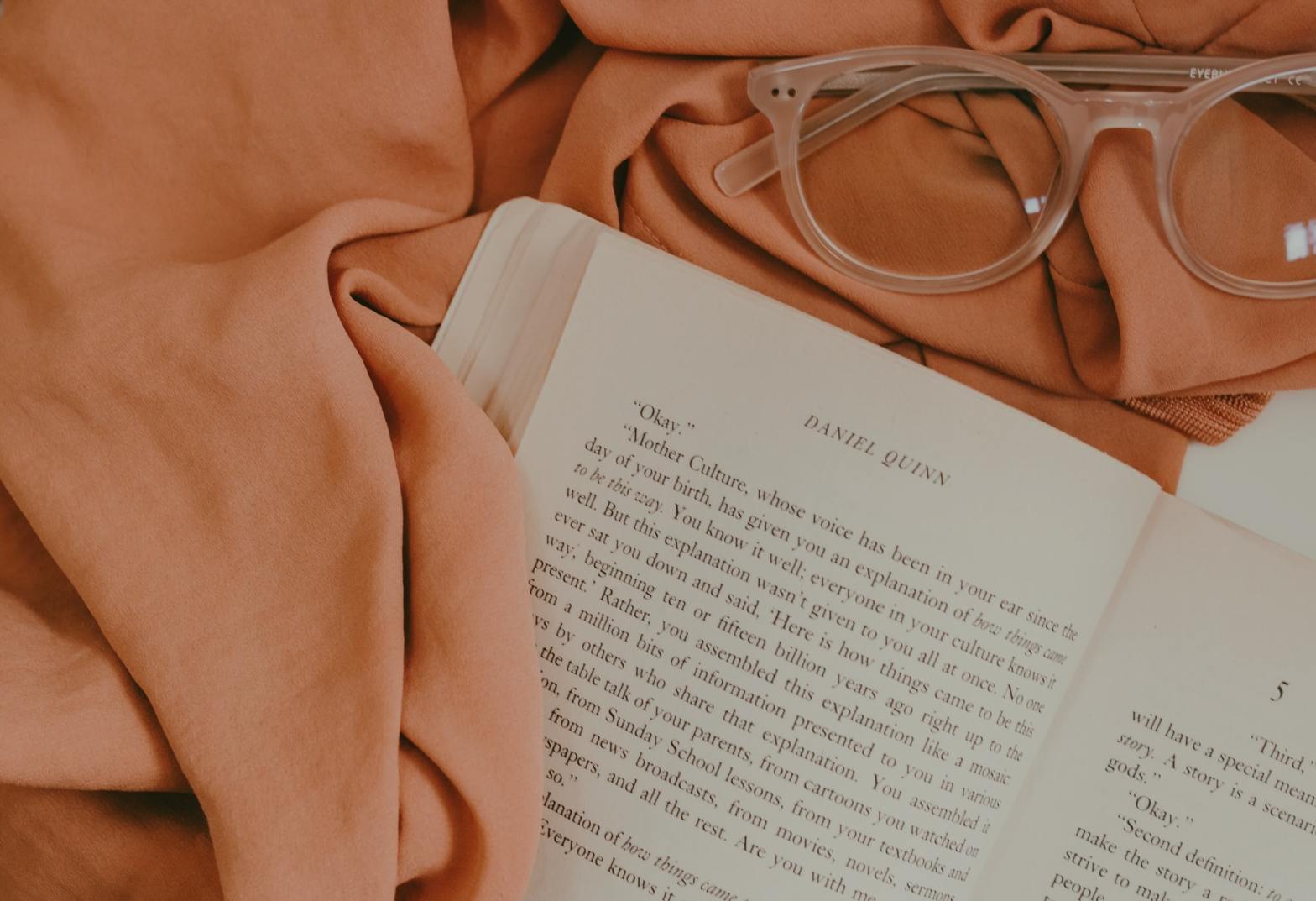 An open book and an eyeglasses