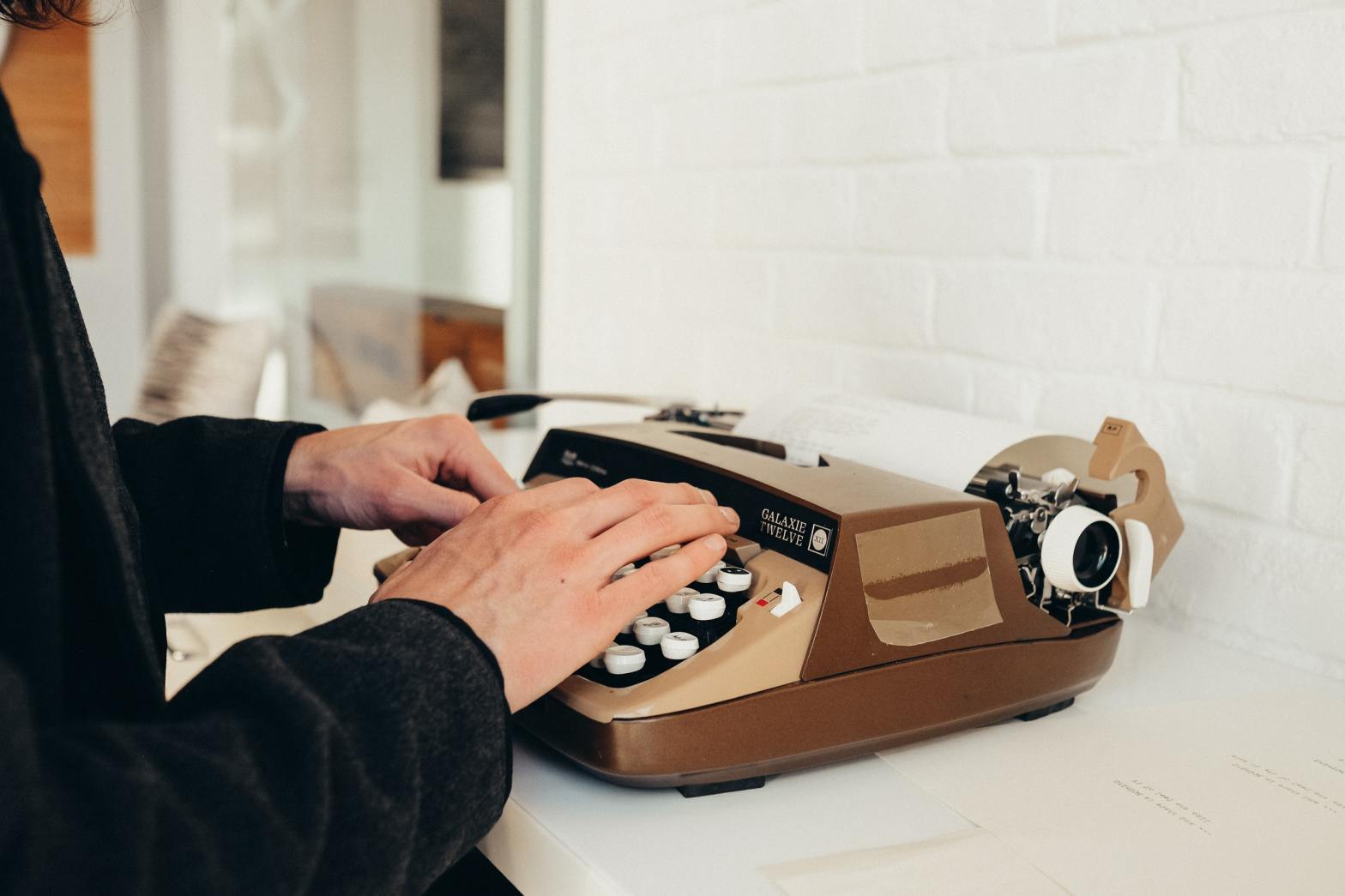 A person using a typewriter